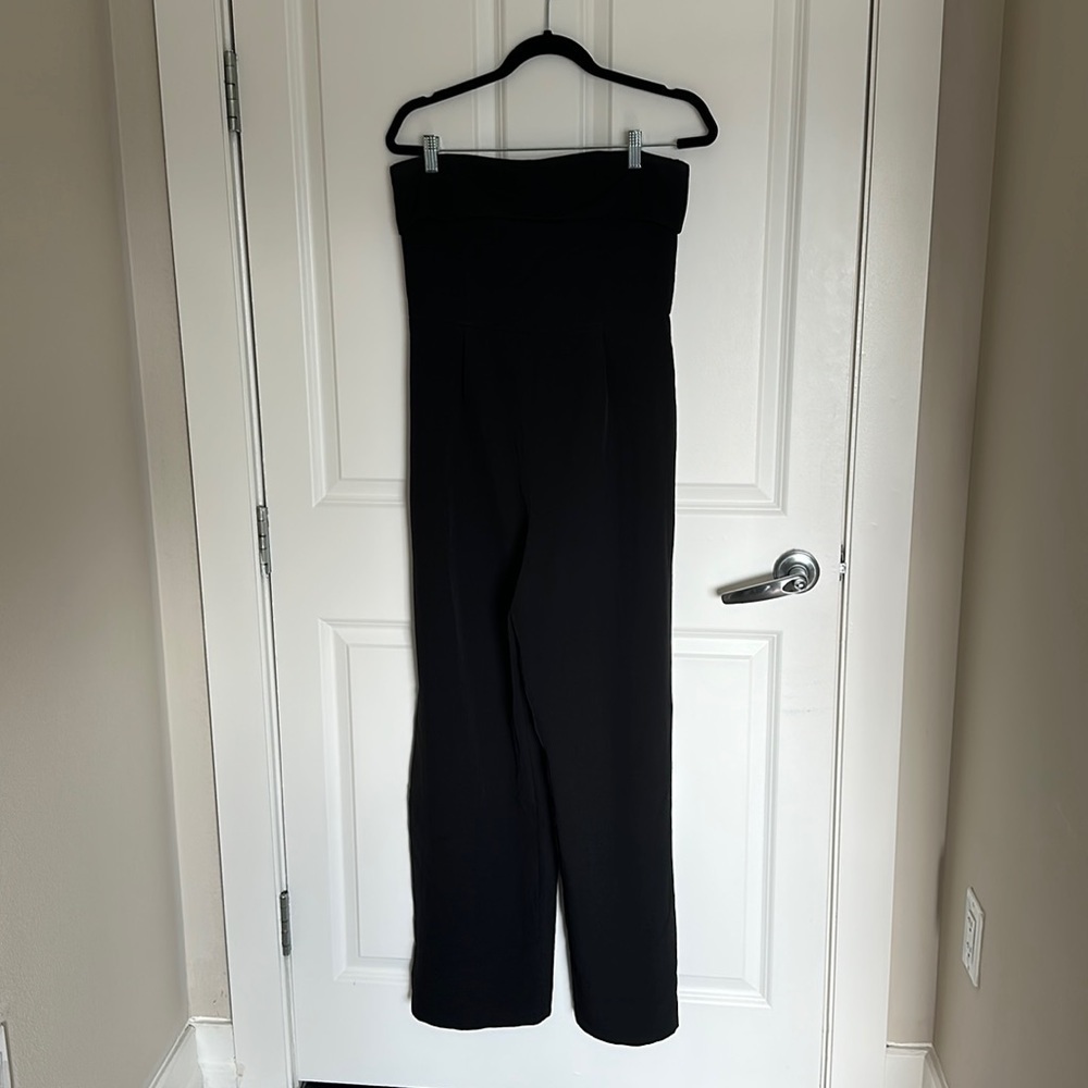 Adorable, sleeveless black jumpsuit, one leg with pocket size large